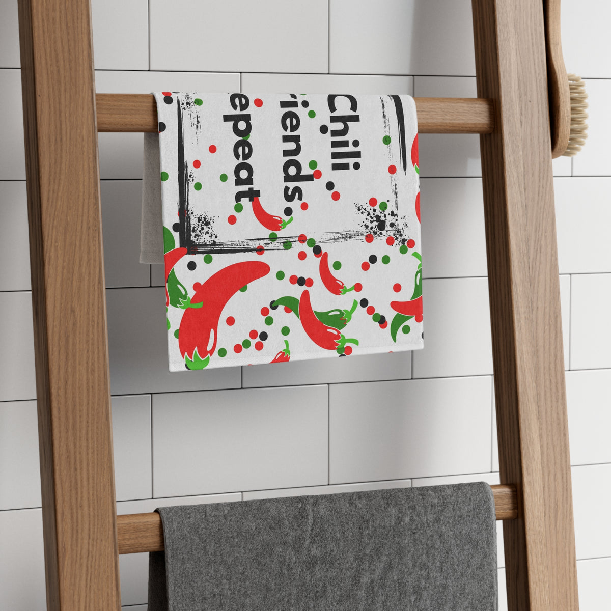 Chili Friends Repeat kitchen towel displayed in a kitchen with colorful chili pepper design