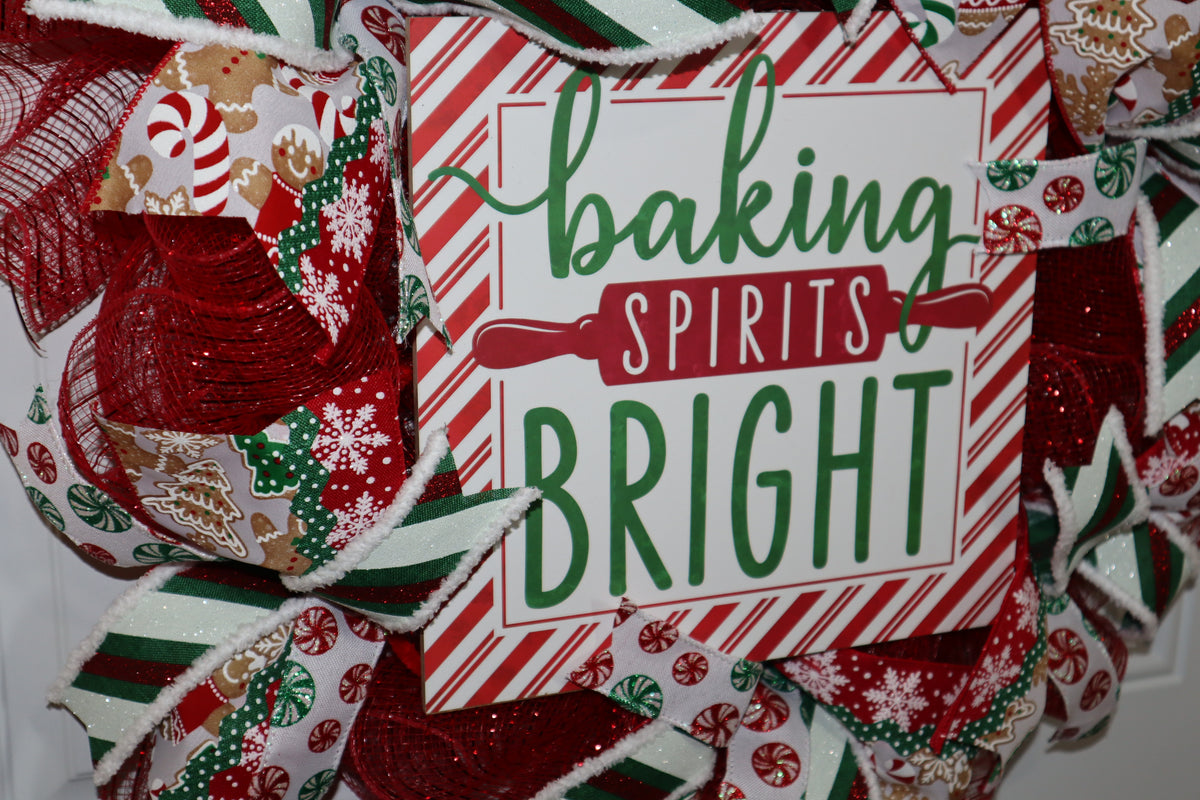 Close-up of Christmas baking wreath sign with red mesh and holiday ribbon
