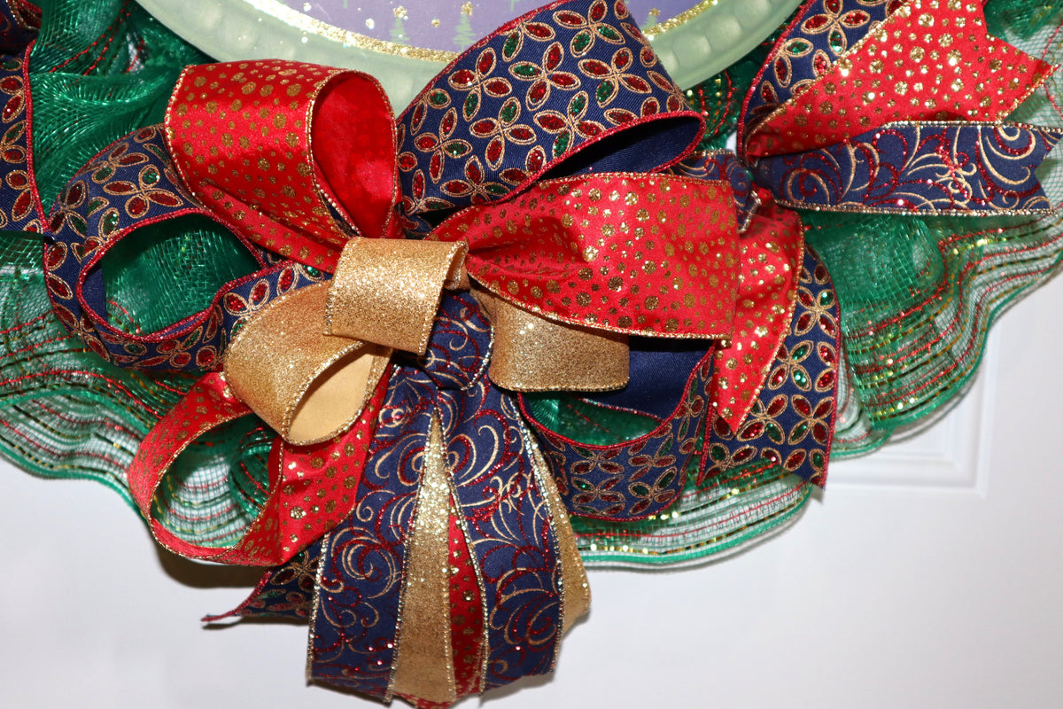 Layered red blue and gold bow on handmade Christmas wreath