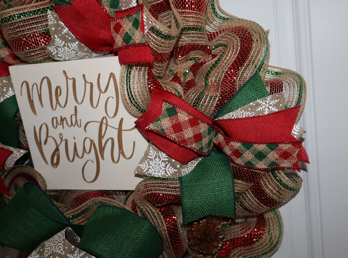 Close-up of red green and natural Christmas ribbon and deco mesh