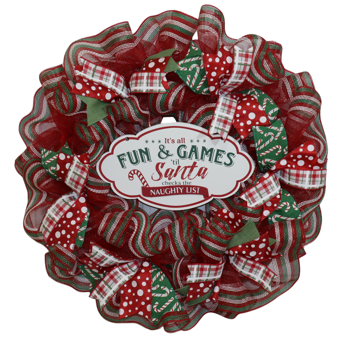 Handmade red and green Christmas mesh wreath with festive ribbon and center sign