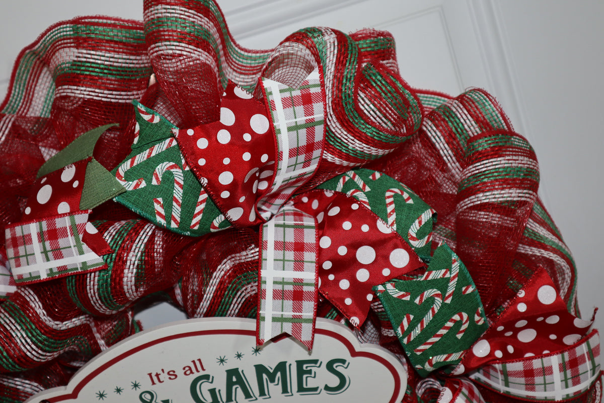 Candy cane plaid and polka dot wired ribbon on Christmas wreath