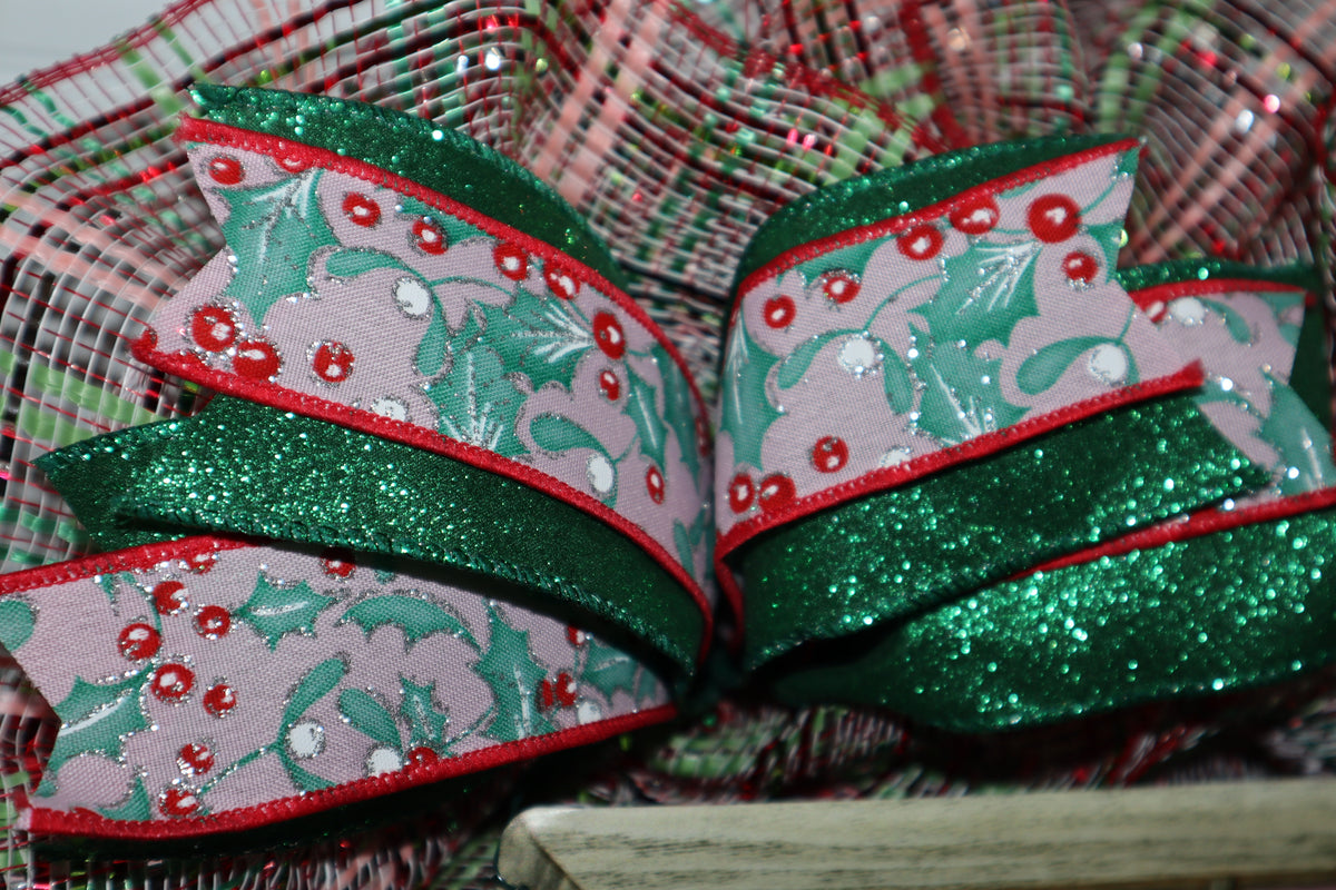 Green glitter and holly wired ribbon detail on Christmas wreath