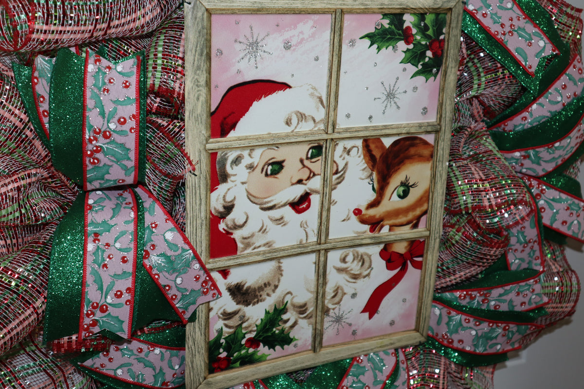 Close-up of vintage Santa and reindeer centerpiece on handmade Christmas wreath