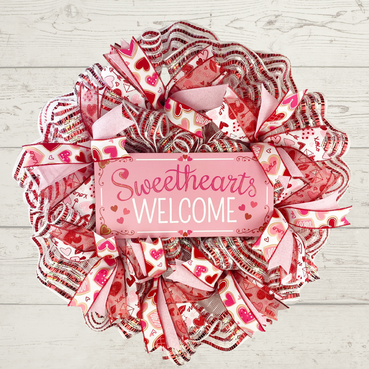 Pink red and white Valentine's Day wreath with Sweethearts Welcome sign
