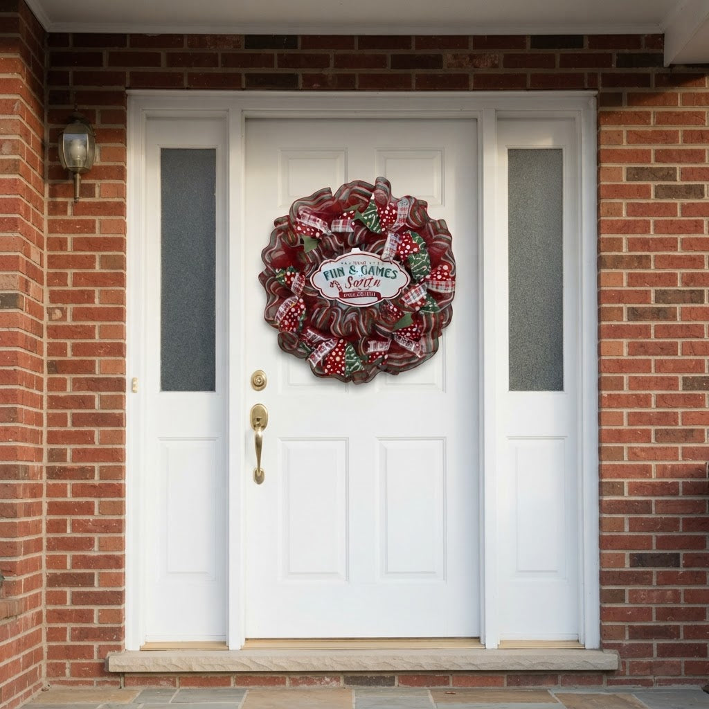 Festive Christmas mesh wreath displayed on white front door