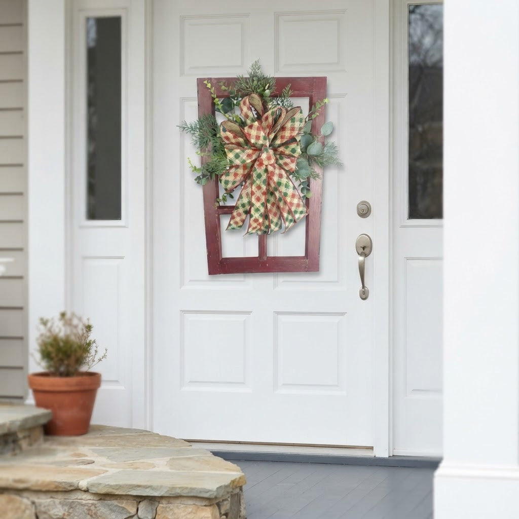 Rustic Christmas window frame door hanger displayed on a white front door for holiday decorating.
