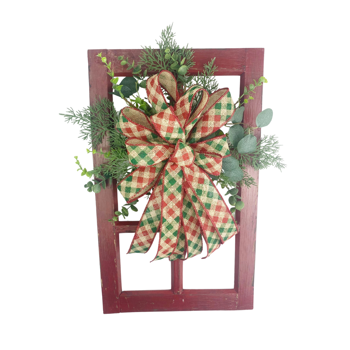 Rustic Christmas window frame door hanger with red and green plaid bow, evergreen greenery, and distressed red wood frame.