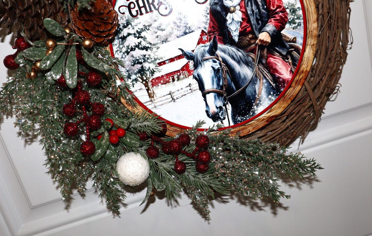 Close-up of red berries pinecones and frosted greenery on grapevine wreath