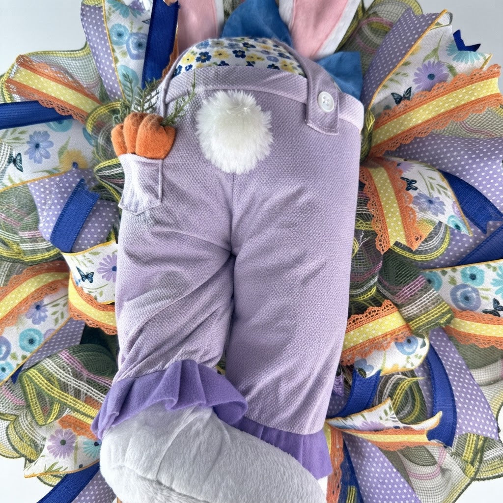 Detailed view of the bunny butt design featuring plush feet, floppy ears, fluffy tail, and decorative carrots.
