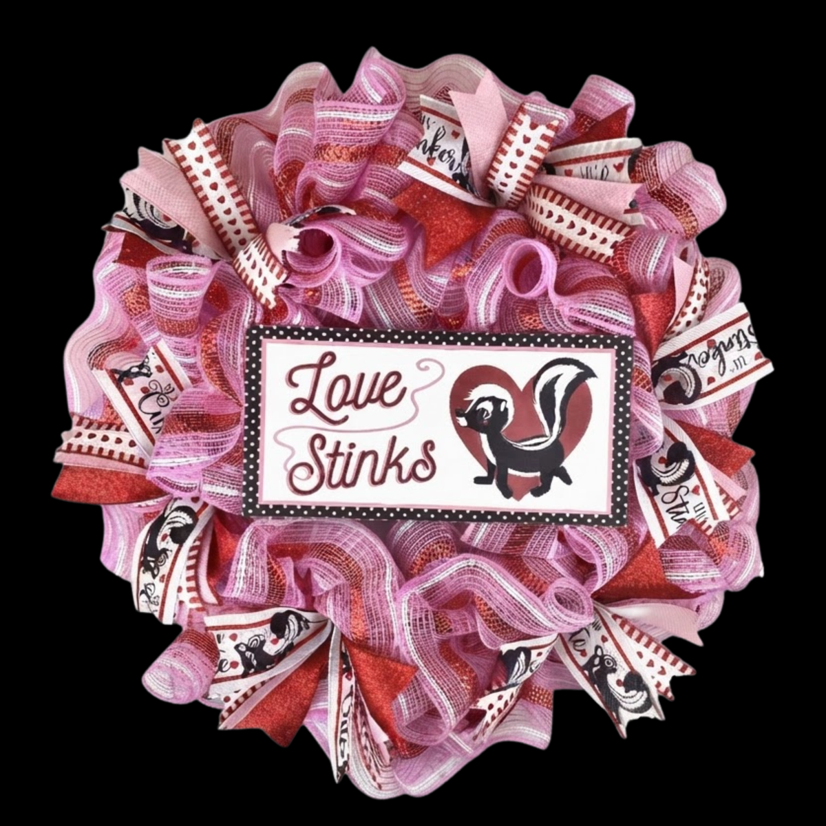 Love Stinks Valentine's Day mesh wreath with pink and red ribbon on black background.