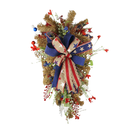 Rustic patriotic teardrop door swag with red white and blue designer bow on white background