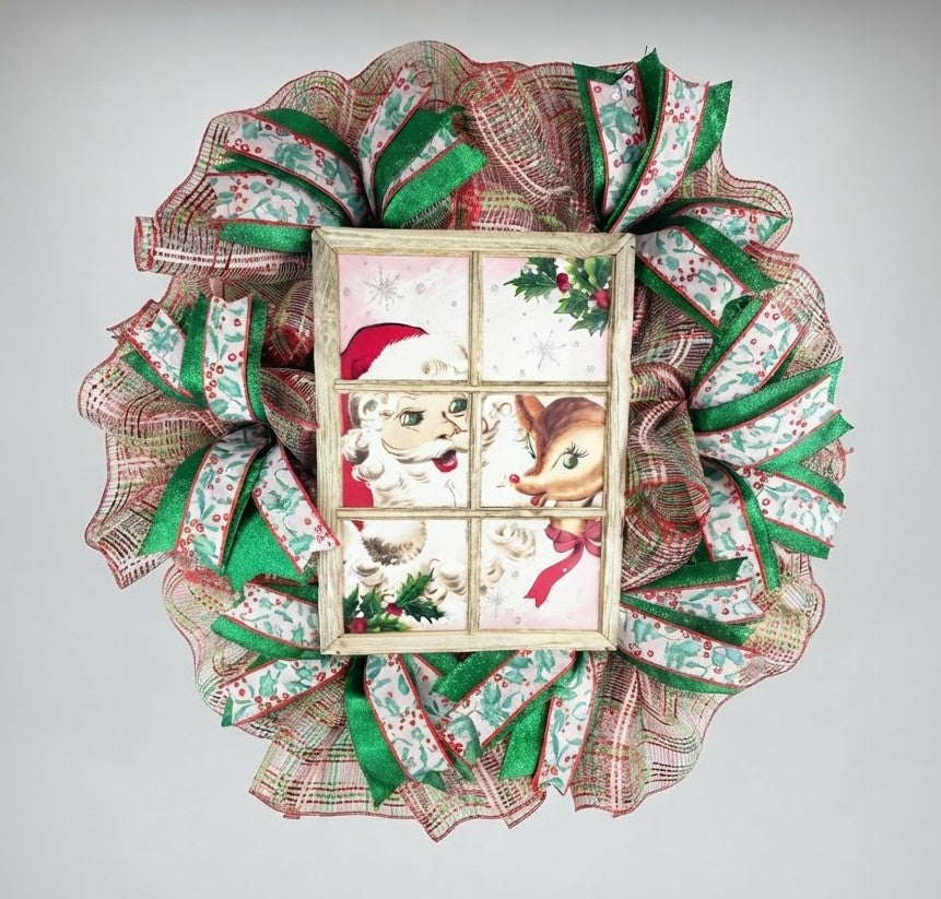 Handmade Santa and reindeer Christmas wreath with festive mesh and ribbon