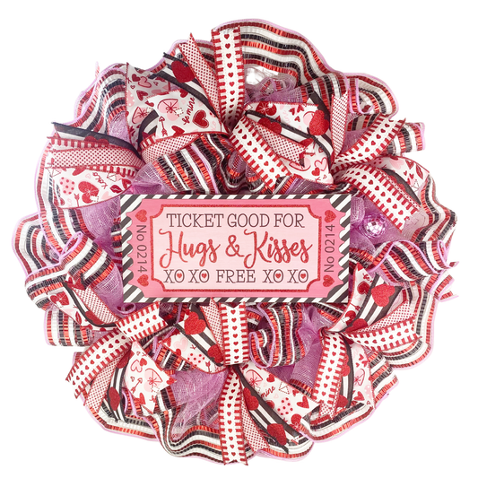 Handmade Hugs and Kisses Valentine’s Day wreath with pink deco mesh and red black white heart ribbons